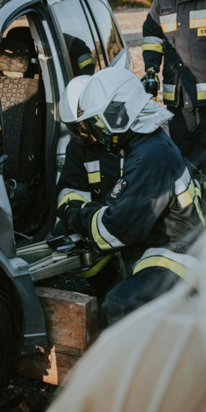 Firefighters conduct emergency extraction from a vehicle during a rescue drill in Poland.