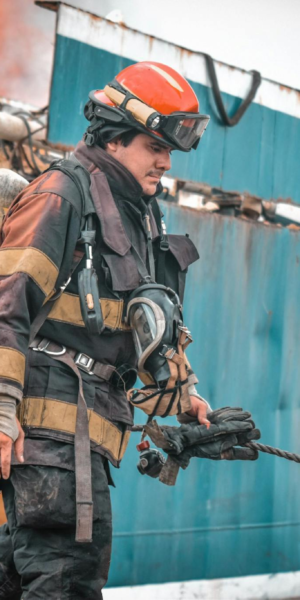 Firefighters in action extinguishing a ship fire in Guayaquil, Ecuador, showcasing bravery and teamwork.